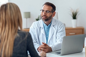 dentist having implant consultation with patient