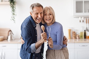 A couple singing in the kitchen