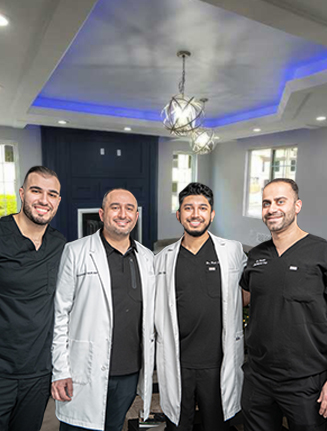 Four smiling Hackensack dentists