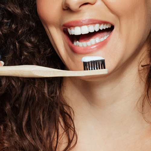 a patient brushing their teeth