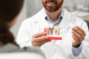 a patient speaking with their dentist about dental implants